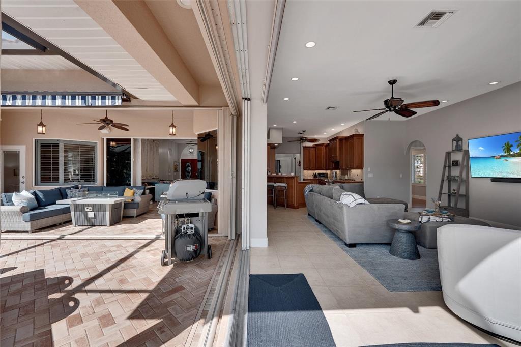 2436 Deborah Drive Punta Gorda, FL 33950 - Photo 37 of 66 a living room with furniture and a chandelier