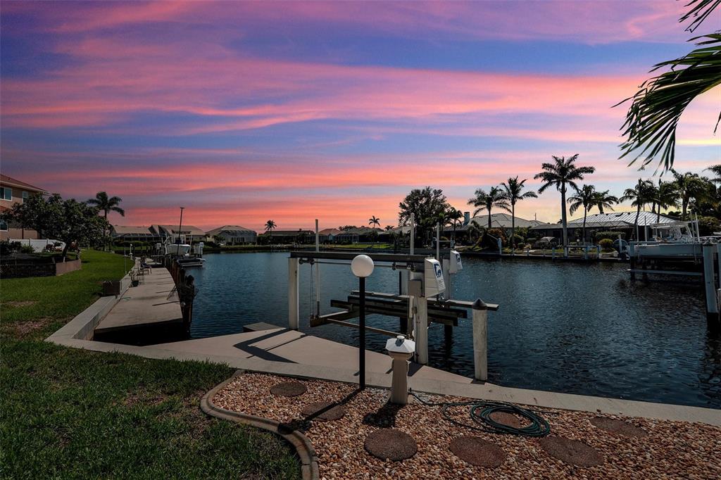 2436 Deborah Drive Punta Gorda, FL 33950 - Photo 45 of 66 a view of a lake with a house