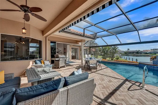 a view of a swimming pool with a patio