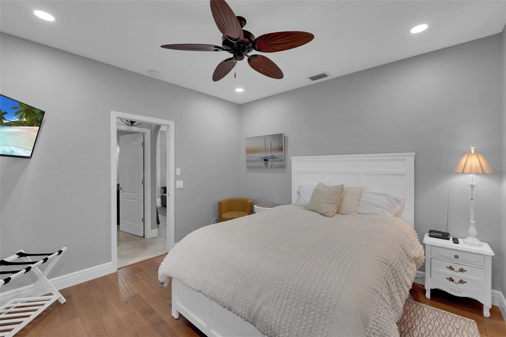 2436 Deborah Drive Punta Gorda, FL 33950 - Photo 54 of 66 a bedroom with a bed and a ceiling fan