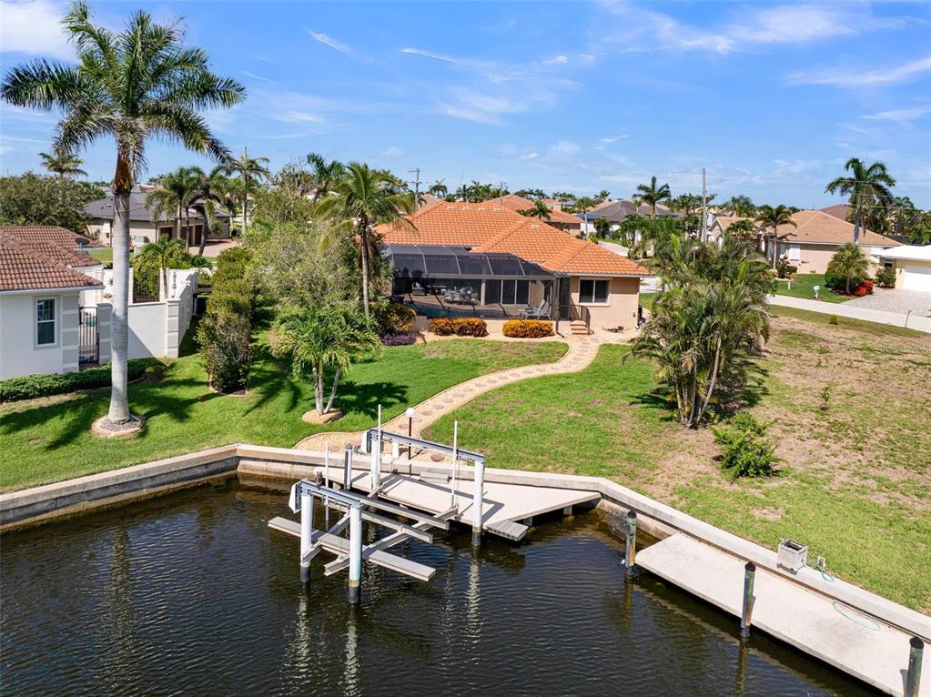2436 Deborah Drive Punta Gorda, FL 33950 - Photo 64 of 66 a view of a lake with a house swimming pool and outdoor space