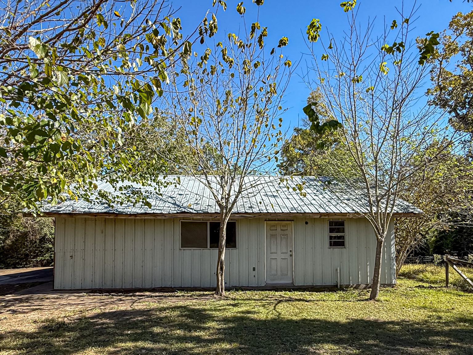 a house with a tree in front of it