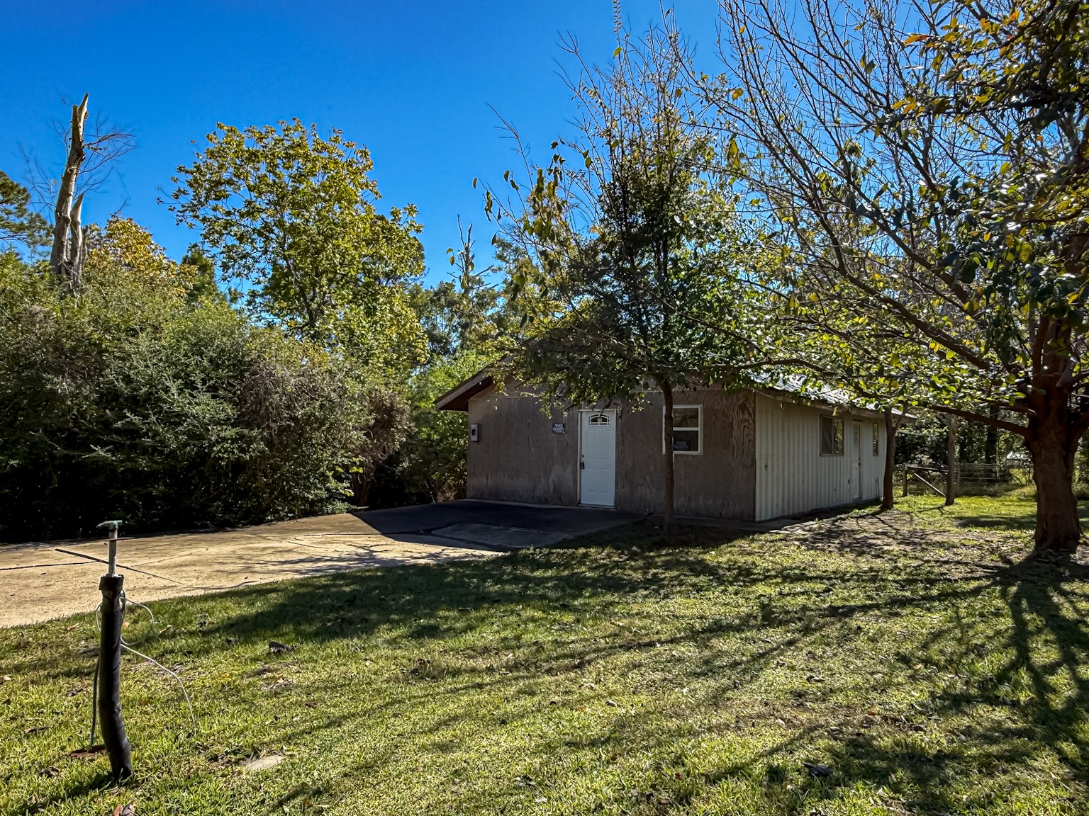 142 West Hickory Cove Onalaska, TX 77360 - Photo 28 of 32 a view of a wooden house with a yard
