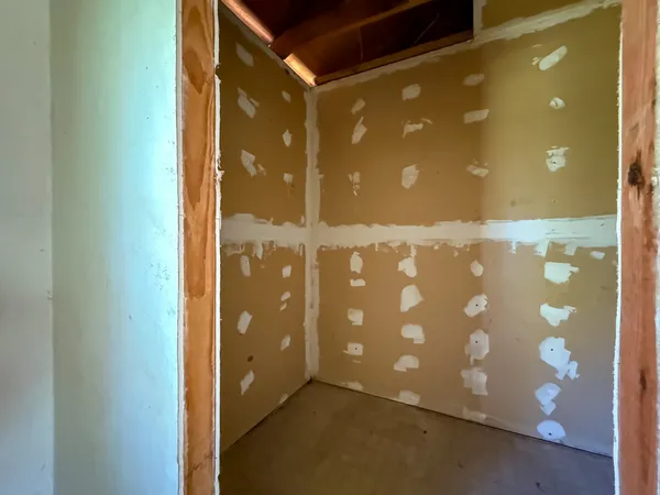 a view of a bathroom with a glass door shower