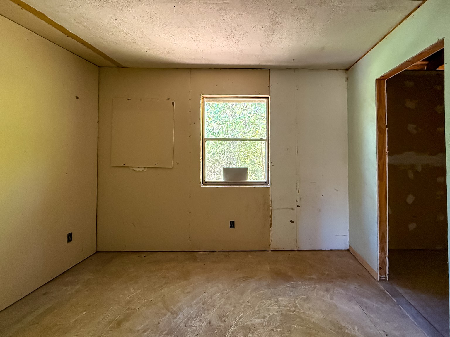 142 West Hickory Cove Onalaska, TX 77360 - Photo 10 of 32 a view of an empty room with a window