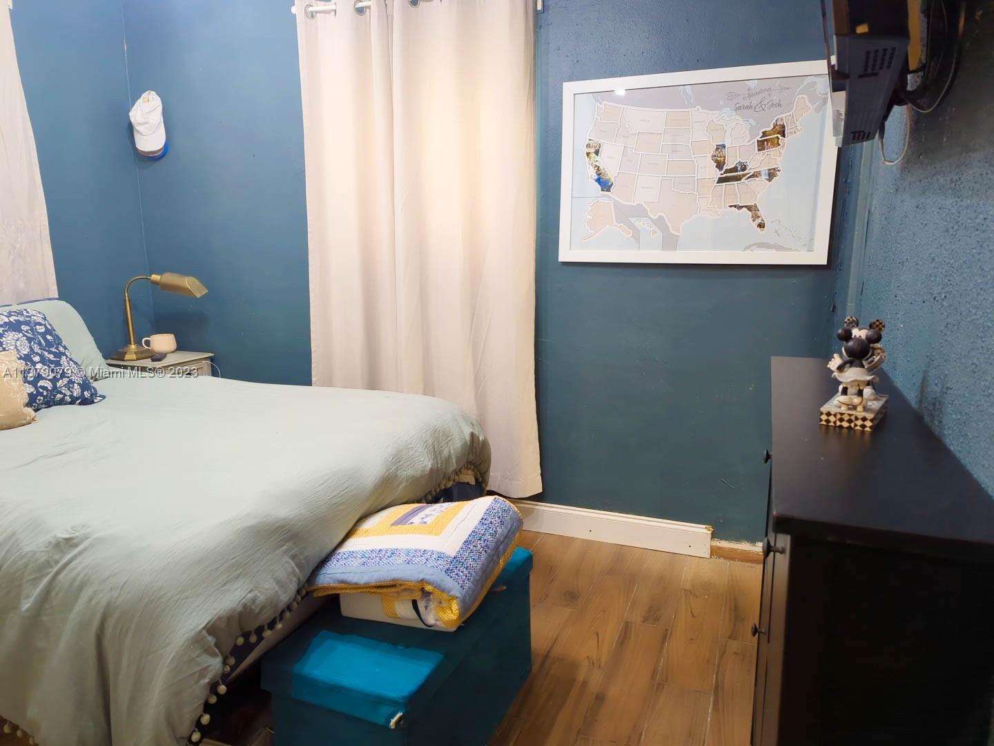 14735 Southwest 302nd Street Homestead, FL 33033 - Photo 15 of 23 a bedroom with a bed and cupboard