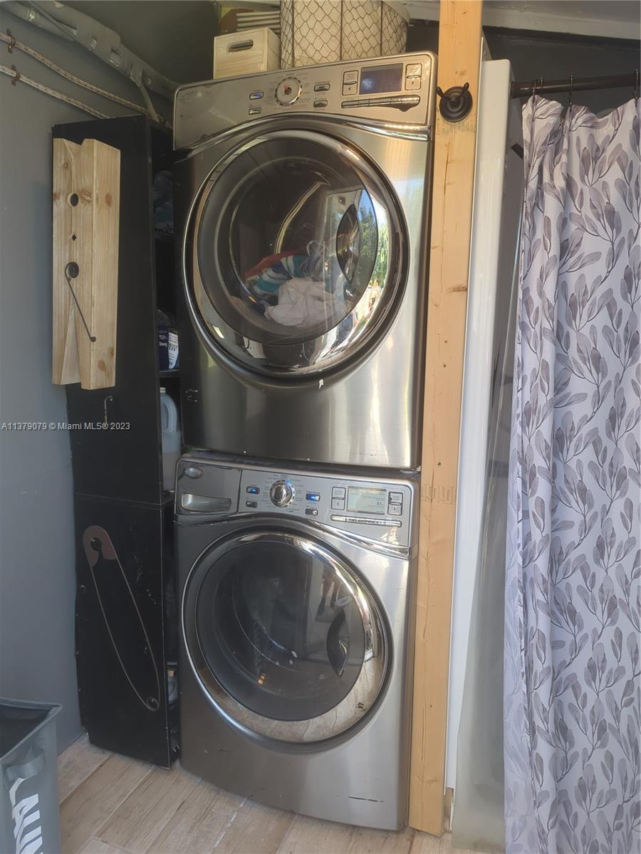 14735 Southwest 302nd Street Homestead, FL 33033 - Photo 17 of 23 a utility room with dryer and washer