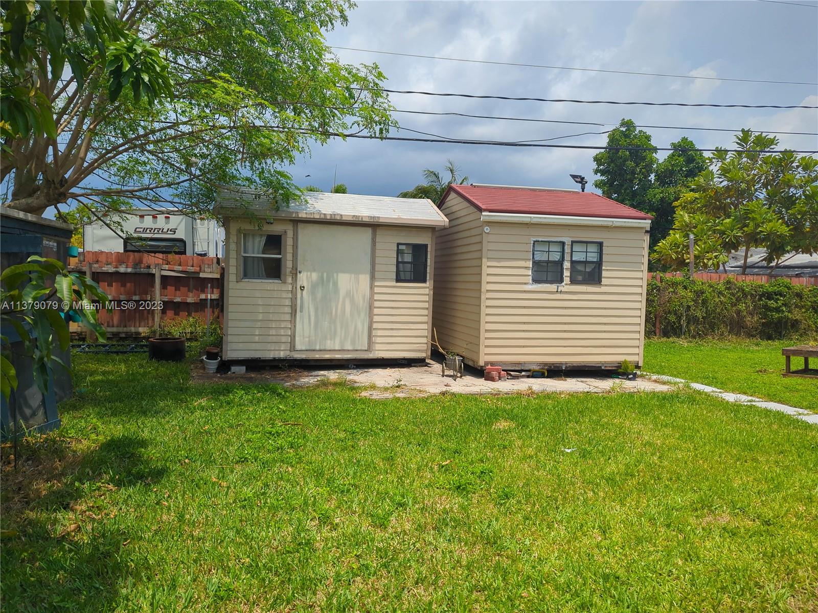 14735 Southwest 302nd Street Homestead, FL 33033 - Photo 19 of 23 a view of a backyard with a garden