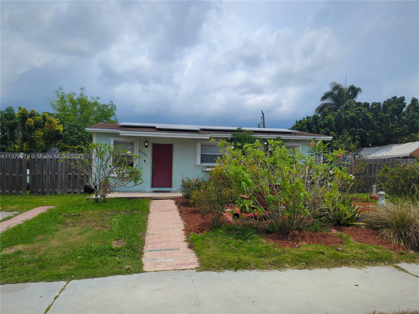 14735 Southwest 302nd Street Homestead, FL 33033 - Photo 23 of 23 a front view of a house with garden