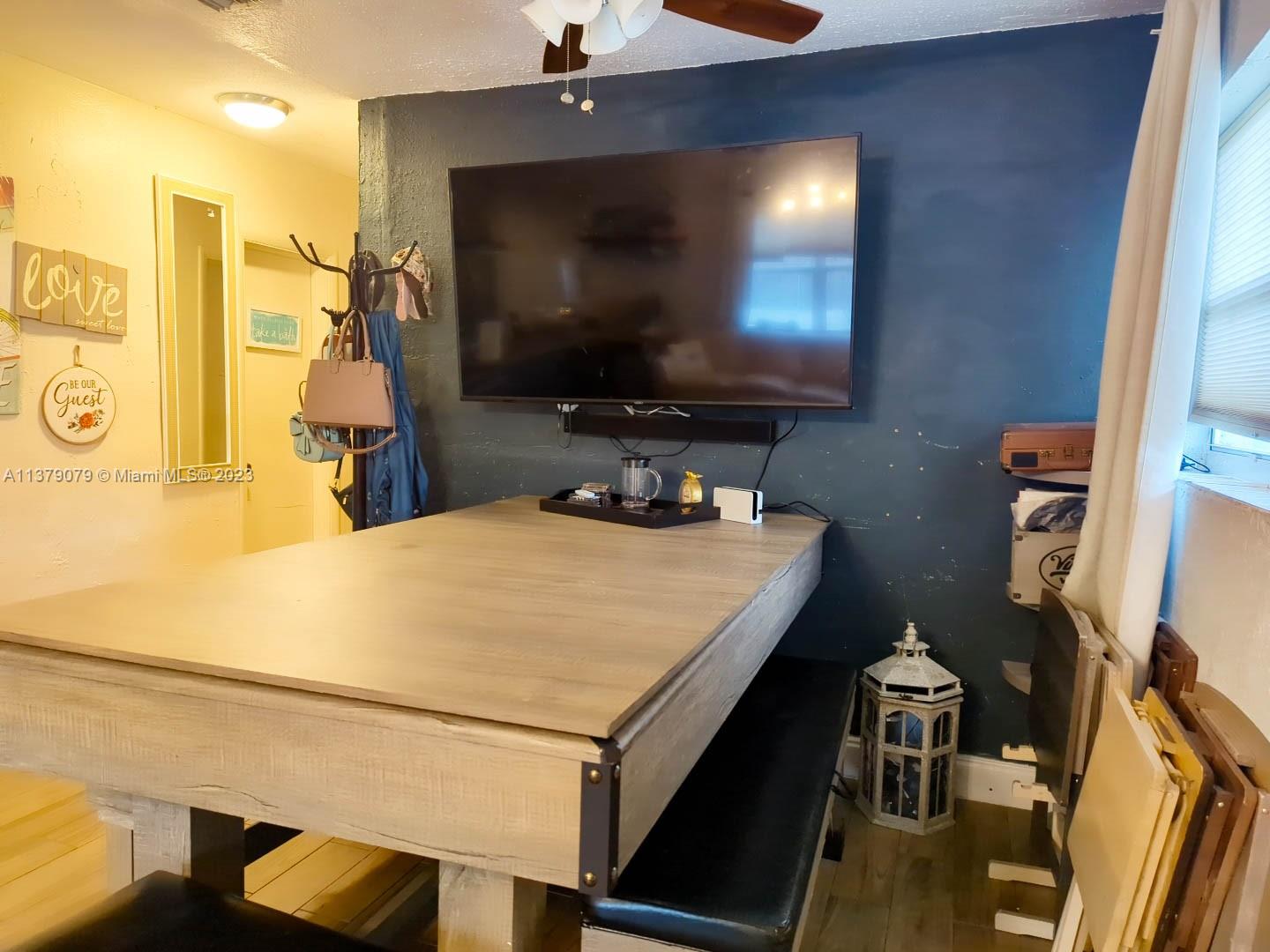 14735 Southwest 302nd Street Homestead, FL 33033 - Photo 7 of 23 a room with a bed and a flat screen tv