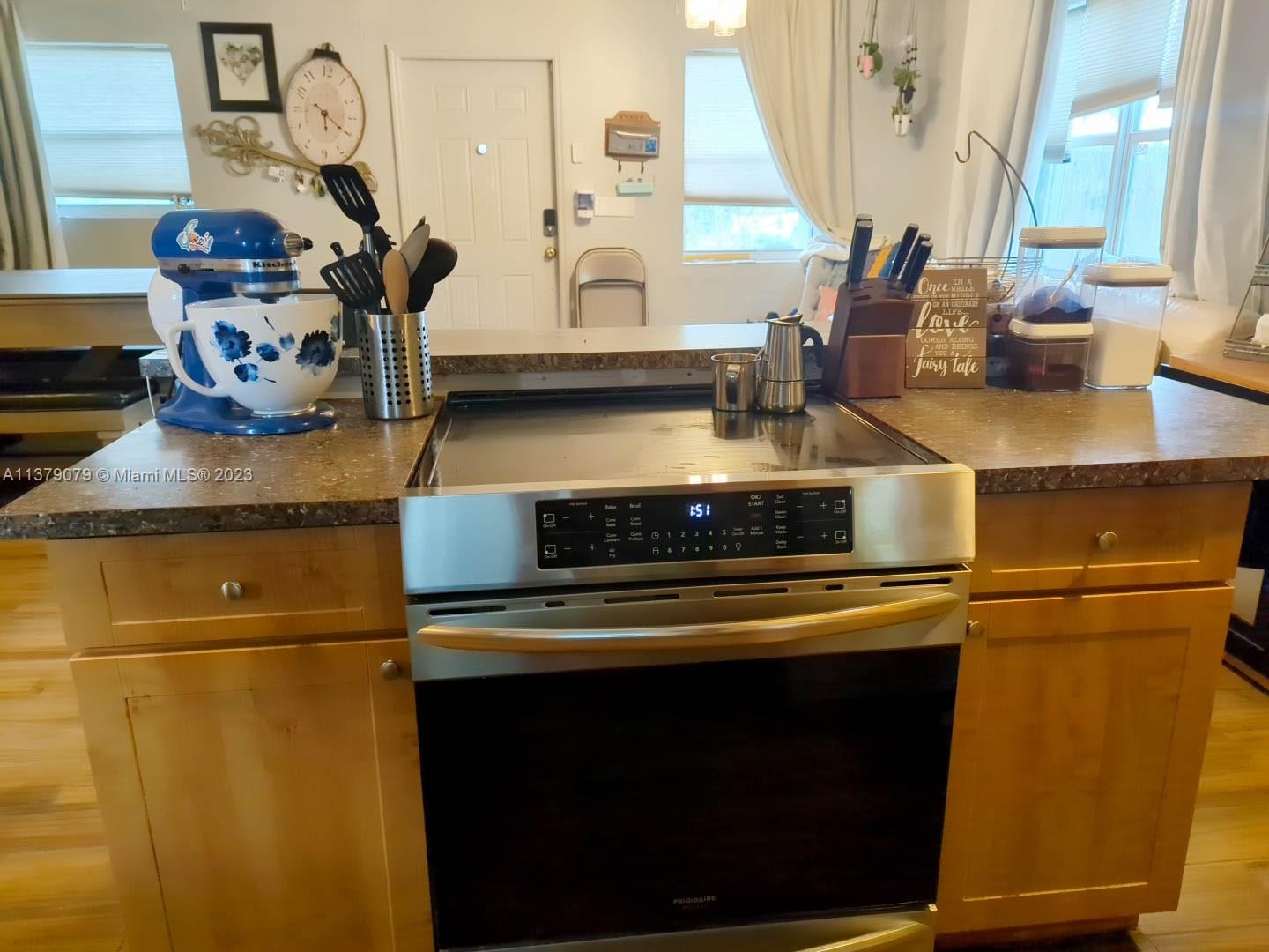 14735 Southwest 302nd Street Homestead, FL 33033 - Photo 10 of 23 a kitchen with a stove and a microwave