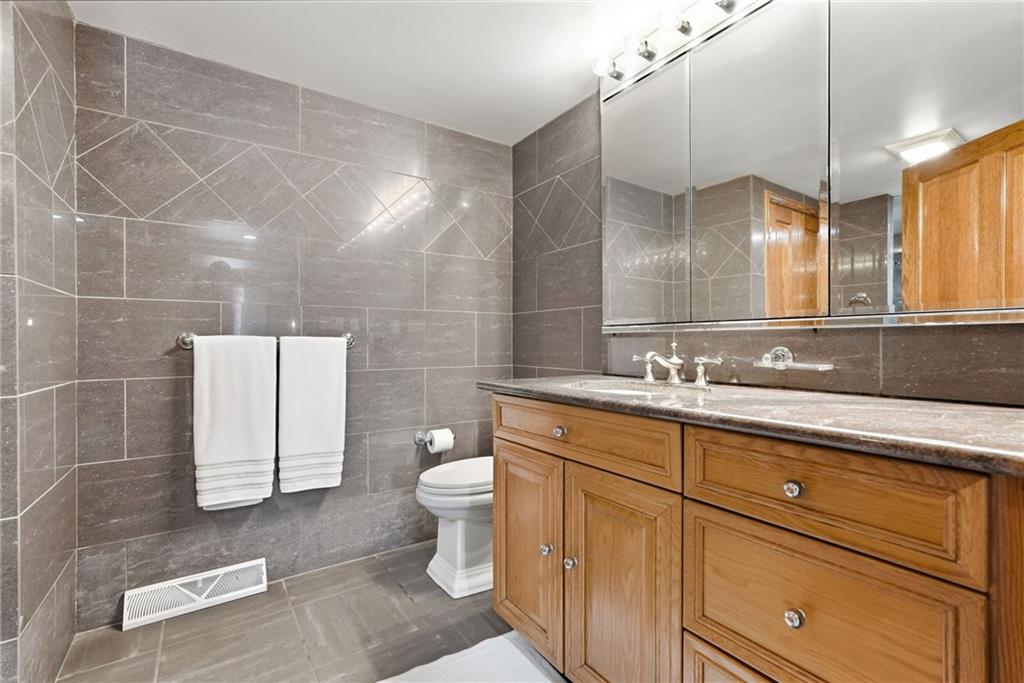 265 McFann Road Valencia, PA 16059 - Photo 42 of 50 a bathroom with a sink a toilet a mirror and vanity