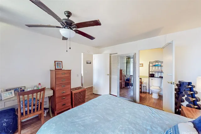 a bedroom with furniture and window