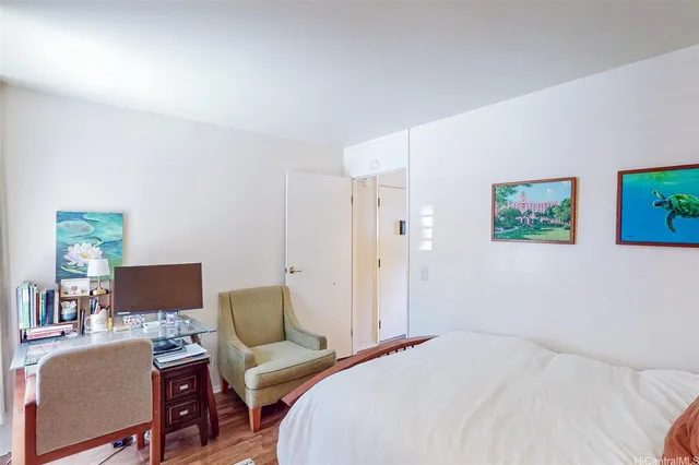 a bedroom with a bed and a couch