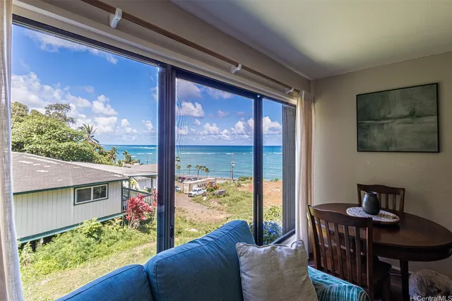 a view of a porch with furniture and a porch