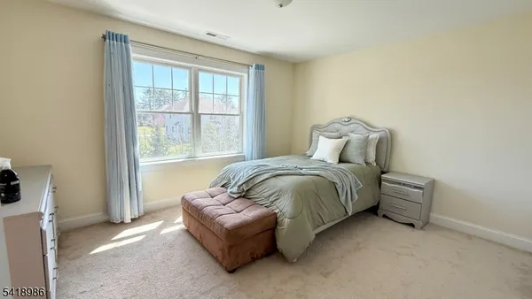 a room with gym equipment and a flat screen tv