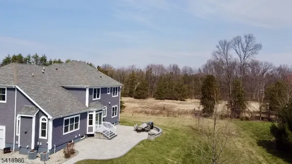 a view of a house with a yard from a balcony