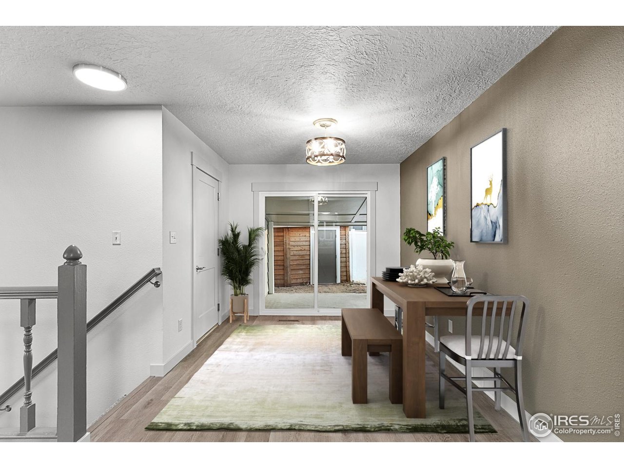 2301 33rd Avenue Greeley, CO 80634 - Photo 11 of 50 a living room with furniture a window and a table