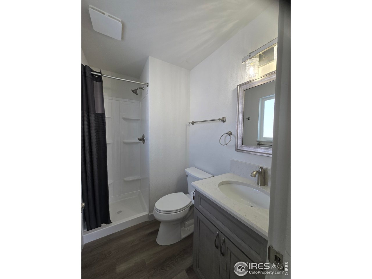 2301 33rd Avenue Greeley, CO 80634 - Photo 15 of 50 a bathroom with a sink a toilet and shower