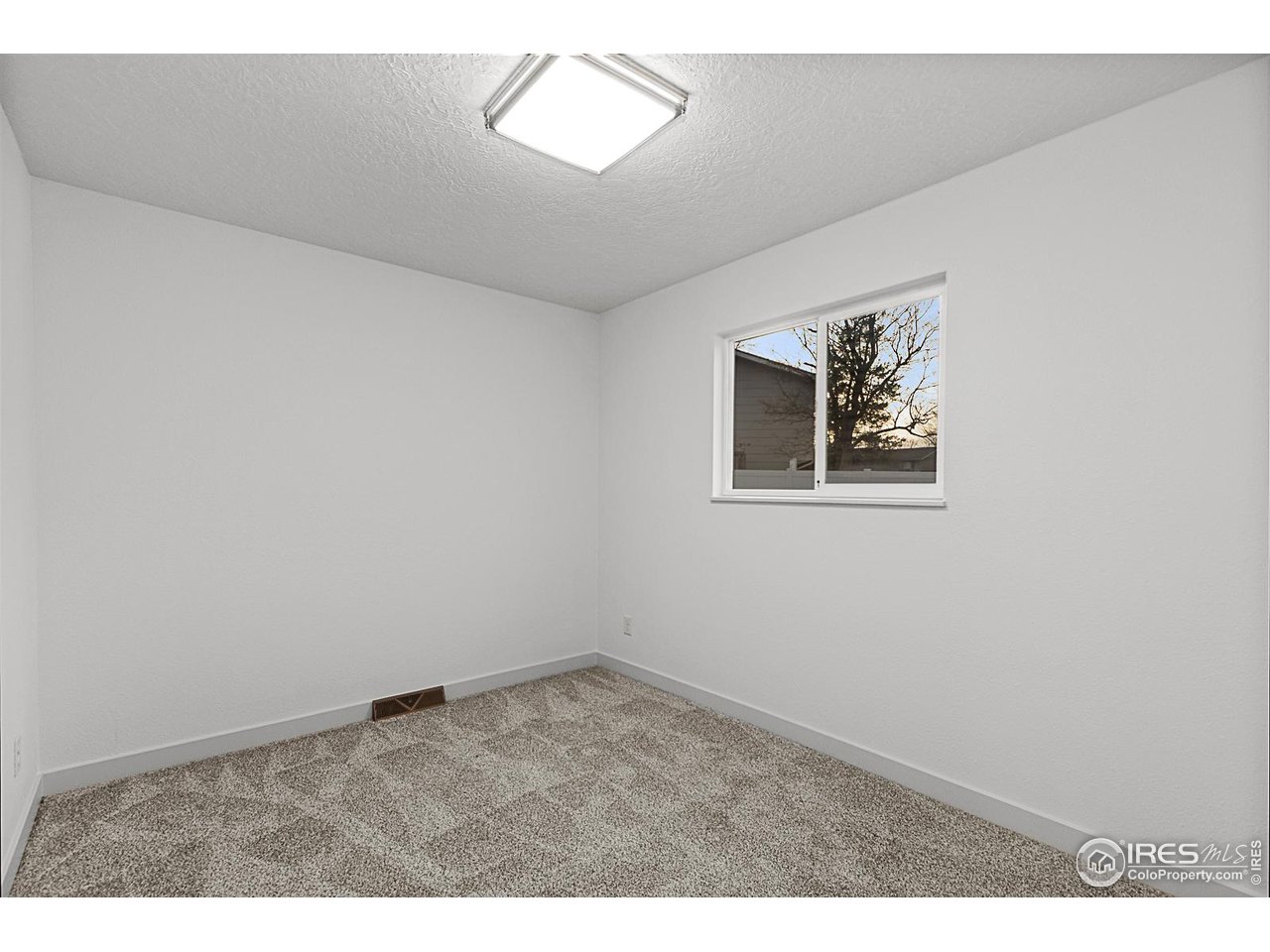 2301 33rd Avenue Greeley, CO 80634 - Photo 16 of 50 a view of an empty room with a window