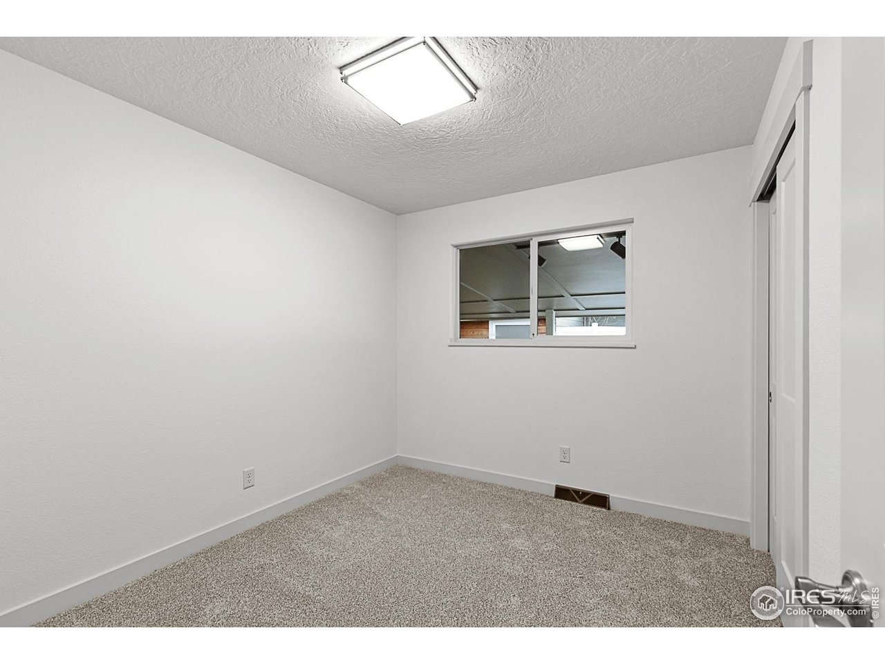 2301 33rd Avenue Greeley, CO 80634 - Photo 19 of 50 an empty room with windows and closet