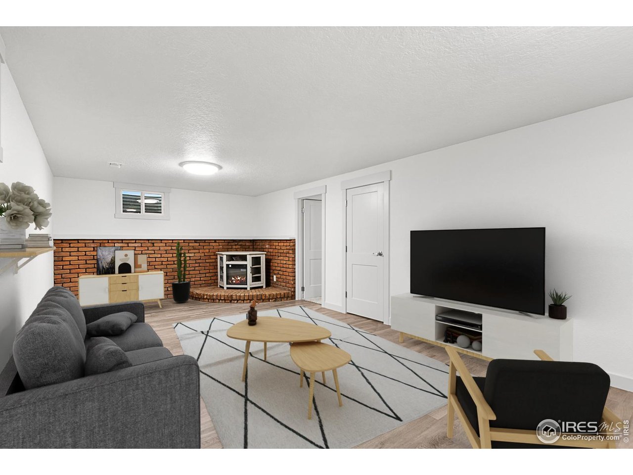 2301 33rd Avenue Greeley, CO 80634 - Photo 26 of 50 a living room with furniture and a flat screen tv