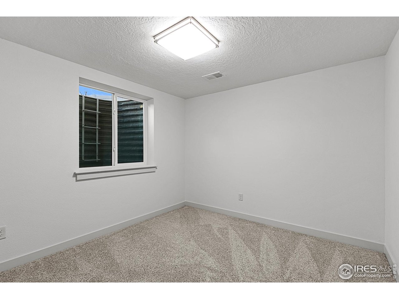 2301 33rd Avenue Greeley, CO 80634 - Photo 29 of 50 a view of an empty room with a window