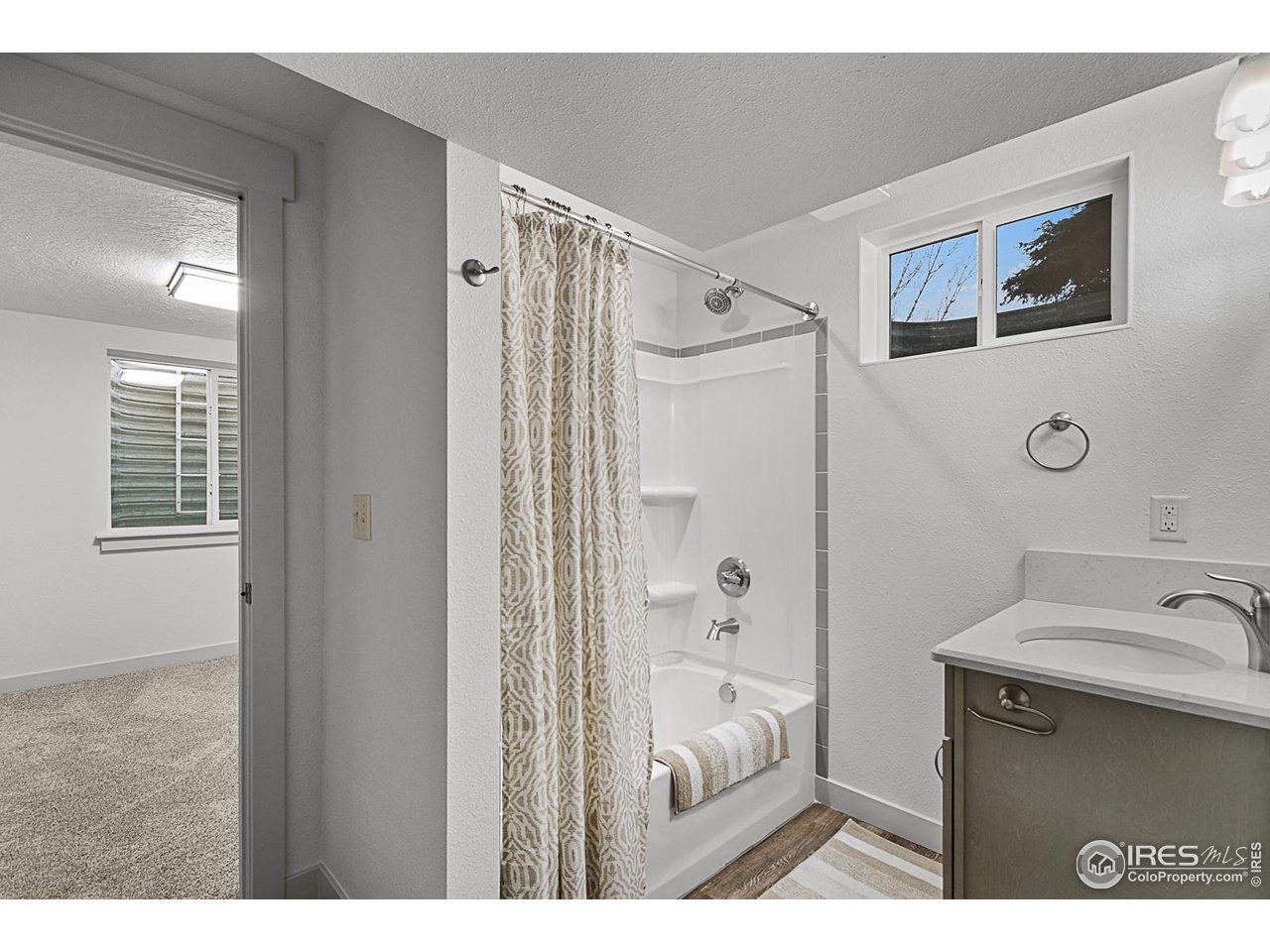 2301 33rd Avenue Greeley, CO 80634 - Photo 30 of 50 a bathroom with a sink and a mirror