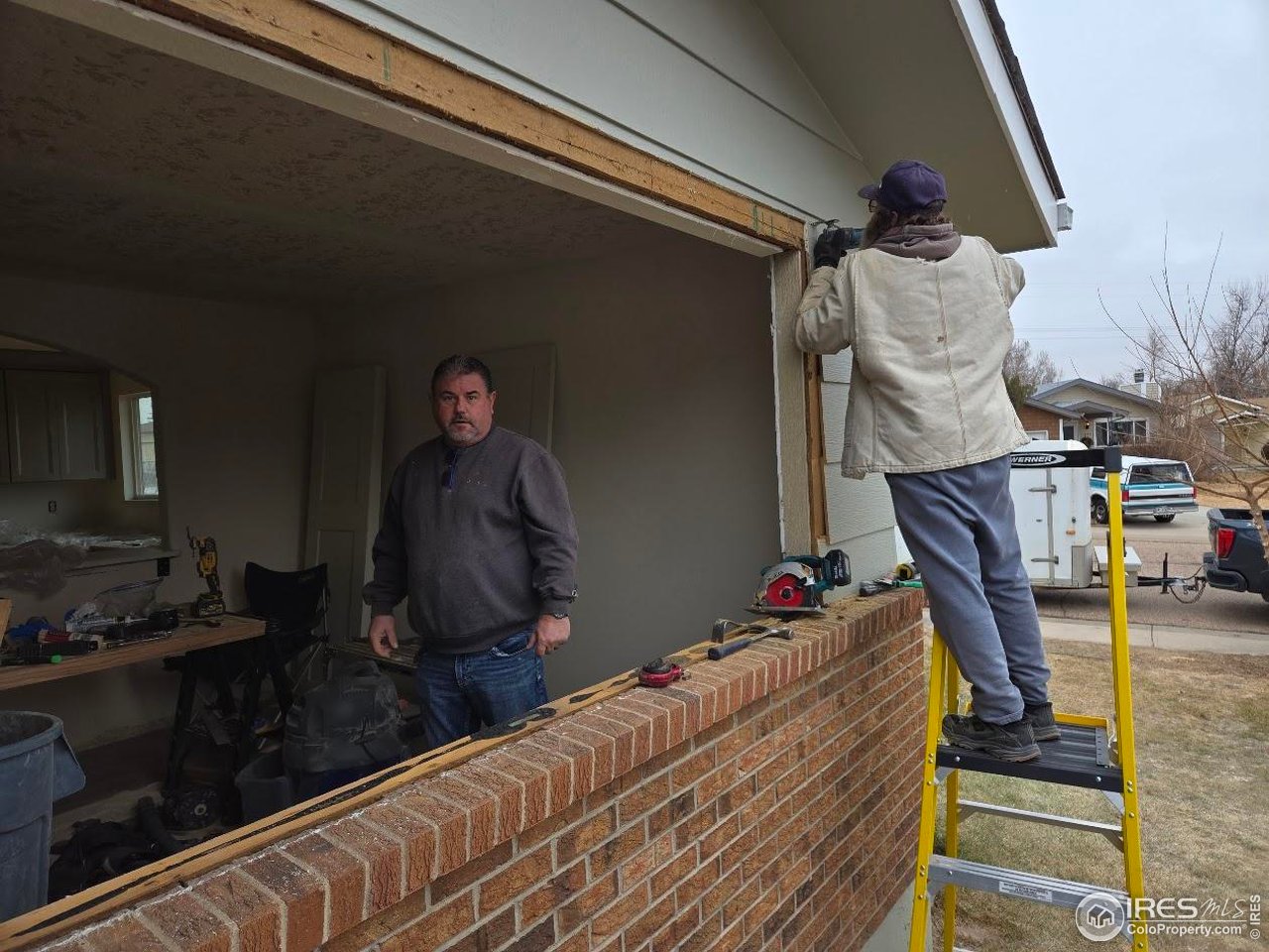 2301 33rd Avenue Greeley, CO 80634 - Photo 50 of 50 a bed room with a bed and a chandelier