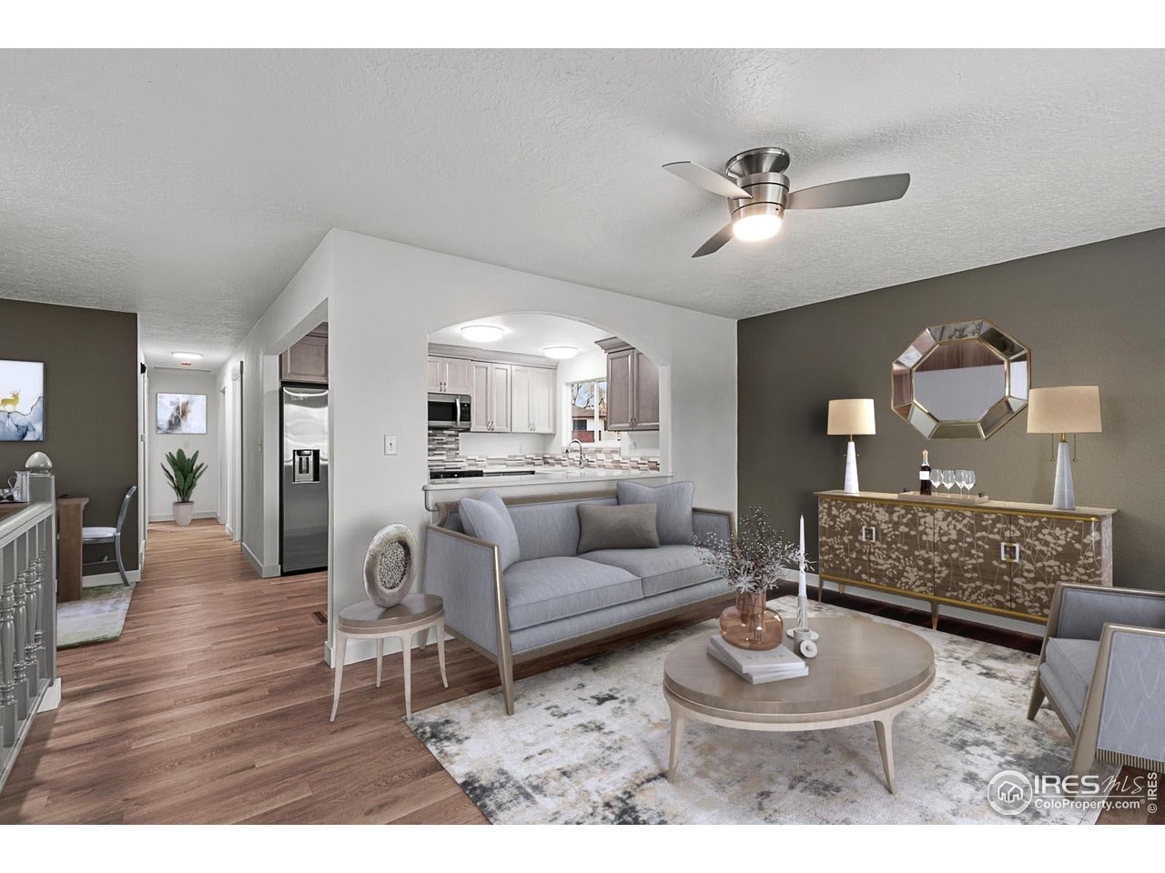 2301 33rd Avenue Greeley, CO 80634 - Photo 5 of 50 a living room with furniture and a wooden floor