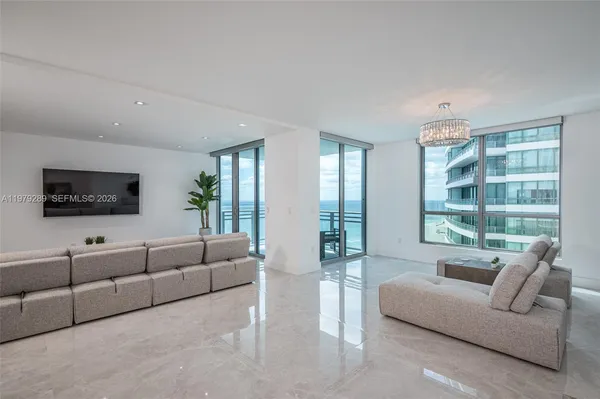 a living room with furniture and a flat screen tv