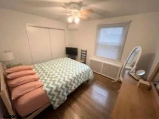 a bedroom with a bed and a chair