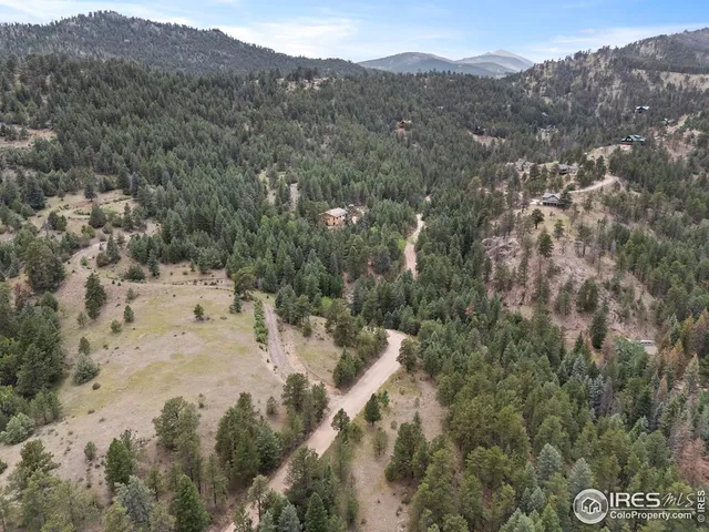 a view of a mountain range with trees