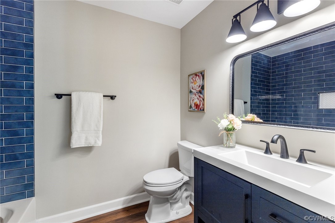6940 Manning Road Chesterfield, VA 23832 - Photo 22 of 29 Full bathroom featuring toilet, vanity, hardwood f