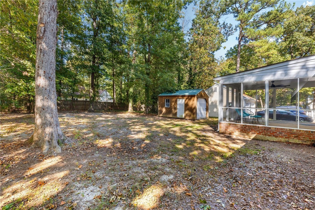 6940 Manning Road Chesterfield, VA 23832 - Photo 27 of 29 View of yard featuring a sunroom and a storage uni