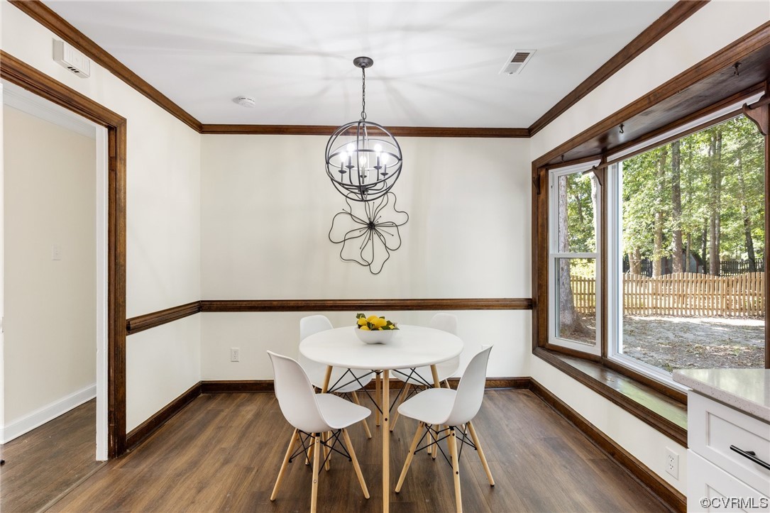 6940 Manning Road Chesterfield, VA 23832 - Photo 10 of 29 Dining space featuring an inviting chandelier, dar