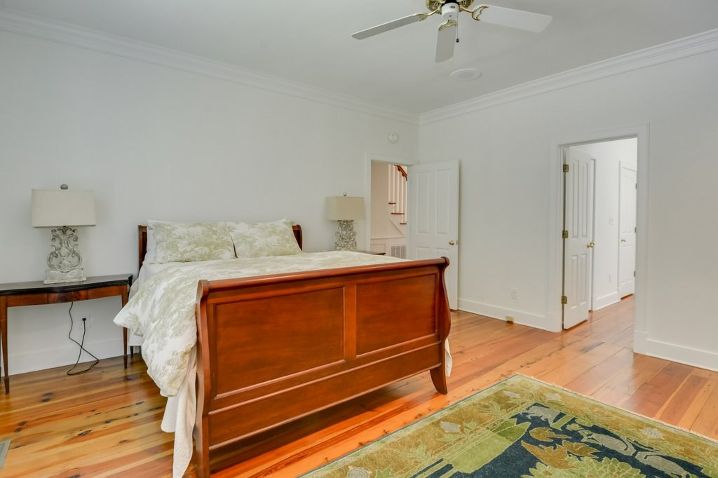 191 North Martintown Road Edgefield, SC 29824 - Photo 33 of 75 a bedroom with a bed and wooden floor