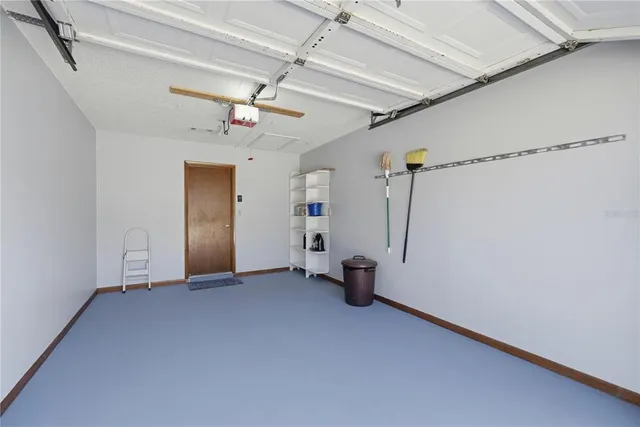 a view of empty room with ceiling fan