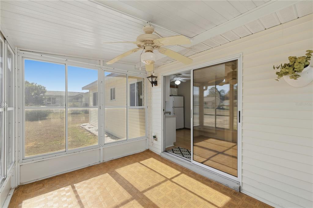 10949 Southwest 79th Terrace Ocala, FL 34476 - Photo 14 of 18 a bathroom with a glass shower door and a window