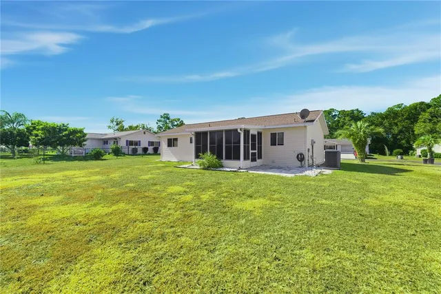 a view of a house with a big yard