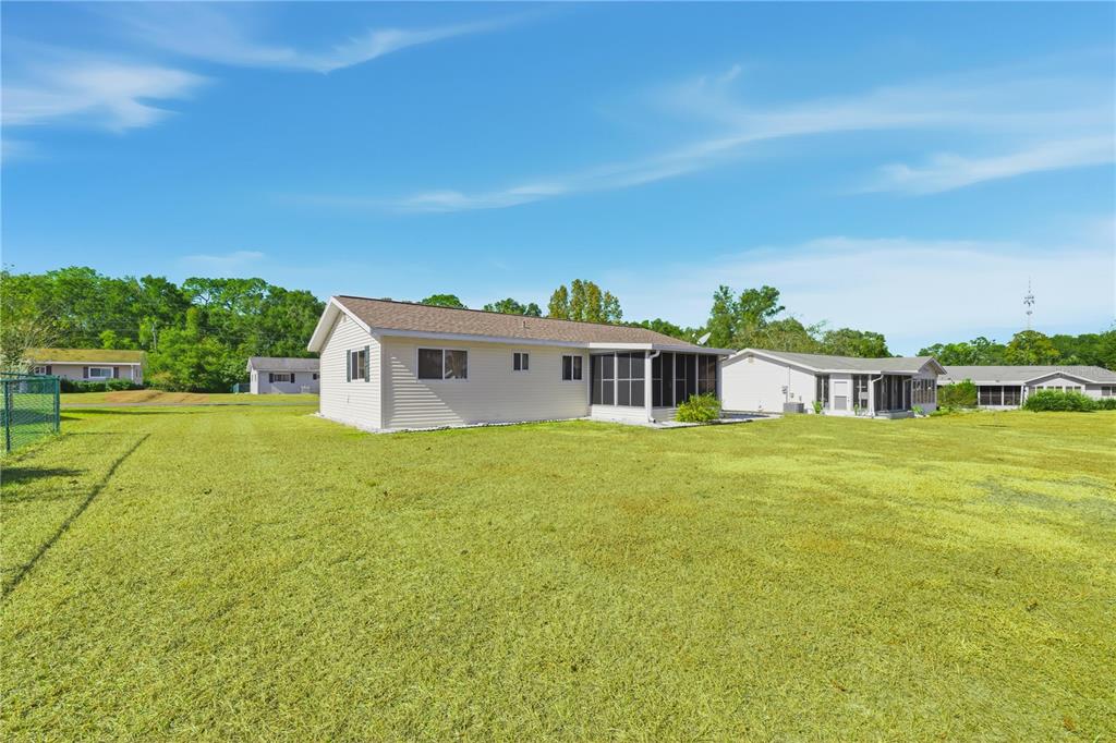 10949 Southwest 79th Terrace Ocala, FL 34476 - Photo 17 of 18 a front view of a house with a yard