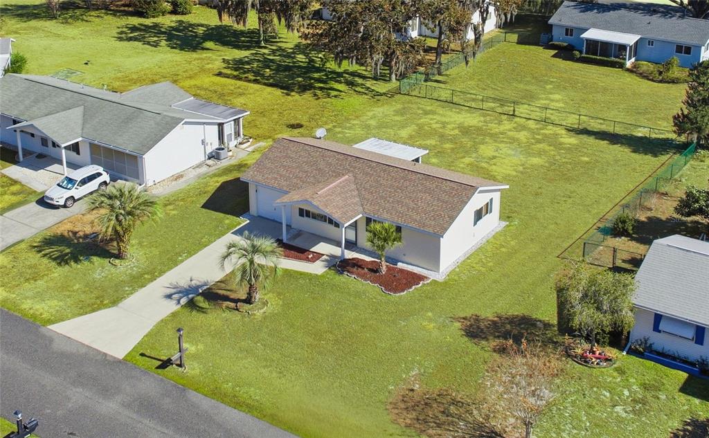 10949 Southwest 79th Terrace Ocala, FL 34476 - Photo 4 of 18 an aerial view of a house with a swimming pool