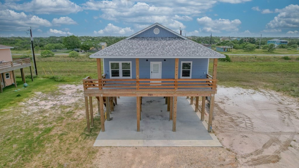 13 Bayview Loop Rockport, TX 78382 - Photo 1 of 26 a view of a house with a yard