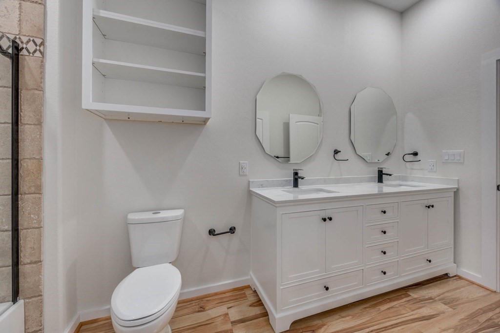 13 Bayview Loop Rockport, TX 78382 - Photo 13 of 26 a bathroom with a toilet sink and mirror