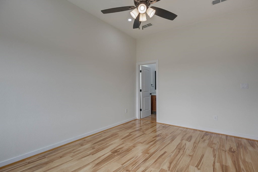13 Bayview Loop Rockport, TX 78382 - Photo 18 of 26 a view of an empty room with wooden floor