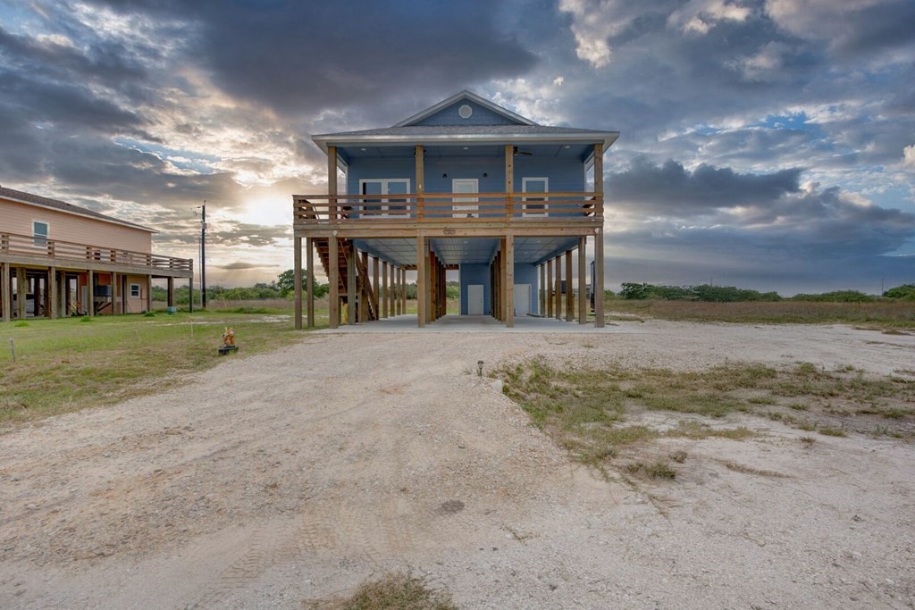 13 Bayview Loop Rockport, TX 78382 - Photo 2 of 26 a view of a house with a yard