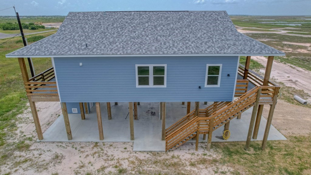 13 Bayview Loop Rockport, TX 78382 - Photo 22 of 26 a view of a house with a yard