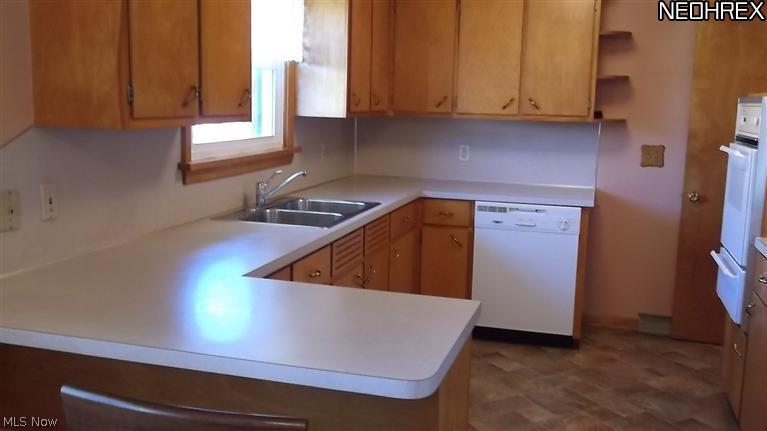 4409 8th Street Northwest Canton, OH 44708 - Photo 5 of 20 Newer counter tops, flooring and appliances