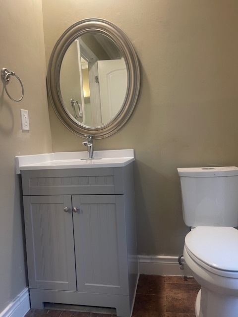 1002 Creekbend Cove Pflugerville, TX 78660 - Photo 14 of 16 Bathroom featuring vanity and baseboards