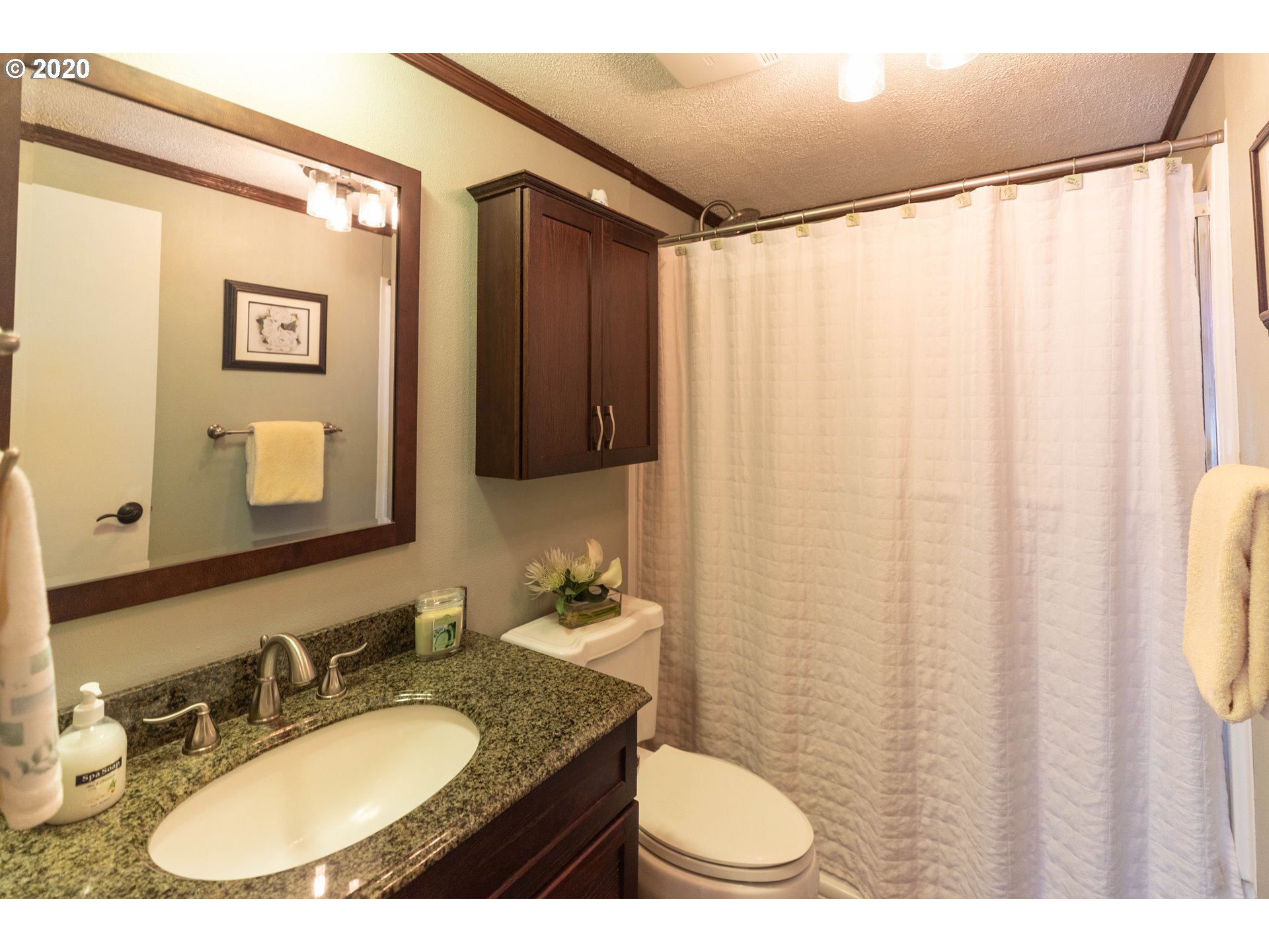 32487 Southeast Colorado Road Sandy, OR 97055 - Photo 15 of 31 a bathroom with a granite countertop sink and a mirror